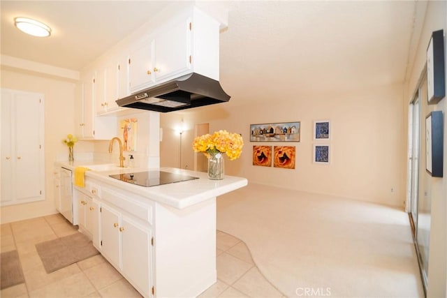 8710 Delgany Ave Unit 15, Playa Del Rey, CA 90293 - kitchen featuring under cabinet range hood, black electric cooktop, white cabinets, and a peninsula