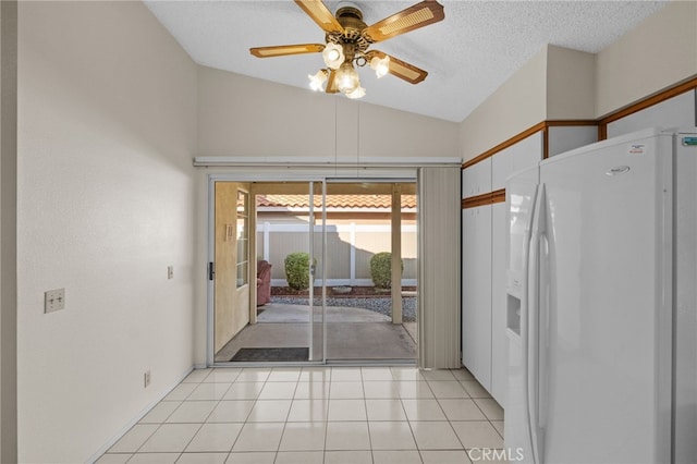 26293 Potomac Dr, Menifee, CA 92586 - kitchen with white refrigerator with ice dispenser, lofted ceiling, ceiling fan, a textured ceiling, and white cabinets