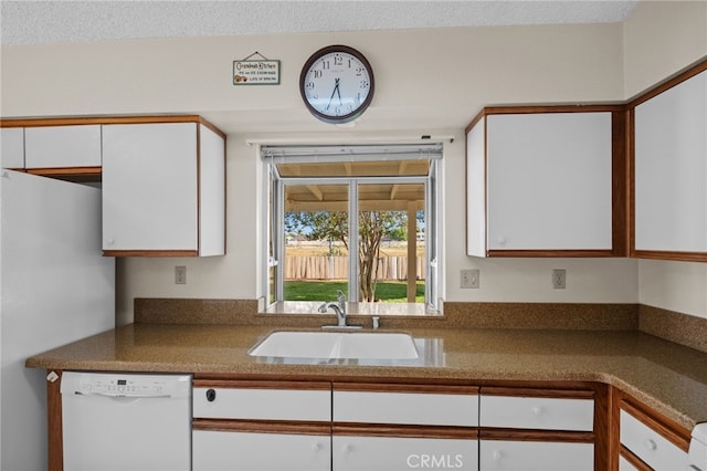 26293 Potomac Dr, Menifee, CA 92586 - kitchen featuring dishwasher, white cabinetry, and freestanding refrigerator