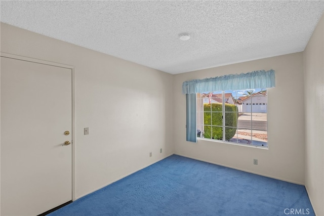 26293 Potomac Dr, Menifee, CA 92586 - carpeted empty room with a textured ceiling and baseboards