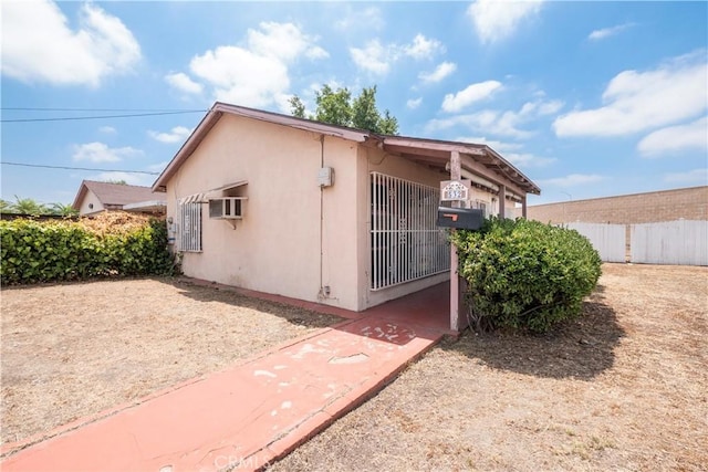 532 W 2nd St, Azusa, CA 91702 - view of property exterior featuring stucco siding and a wall mounted AC