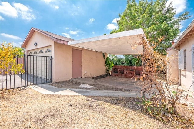 532 W 2nd St, Azusa, CA 91702 - view of front of property with stucco siding and a gate