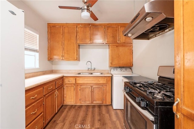 532 W 2nd St, Azusa, CA 91702 - kitchen with gas range, range hood, ceiling fan, wood finished floors, and freestanding refrigerator