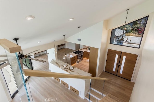 34693 Camino Capistrano Unit B, Dana Point, CA 92624 - foyer featuring wood finished floors, lofted ceiling, and recessed lighting