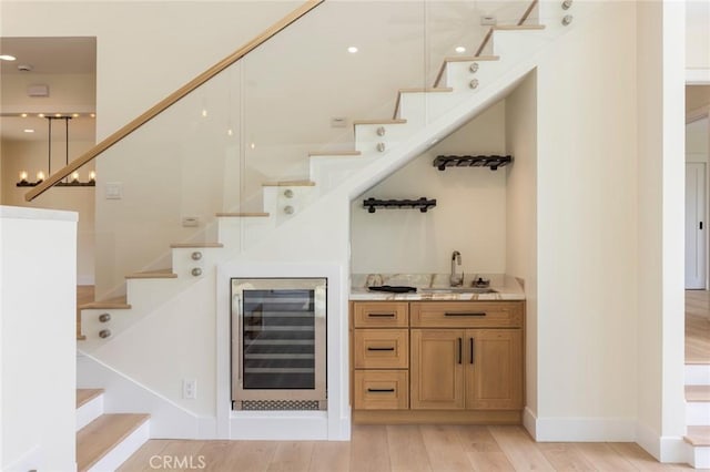 34693 Camino Capistrano Unit B, Dana Point, CA 92624 - indoor wet bar with wine cooler, stairs, and light wood-style flooring