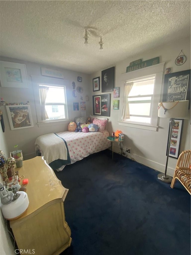 1210 7th Pl, Hermosa Beach, CA 90254 - bedroom featuring multiple windows, carpet flooring, and a textured ceiling