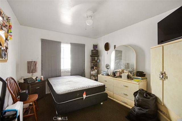 1426 W 83rd St, Los Angeles, CA 90047 - bedroom with dark colored carpet, a ceiling fan, and a closet