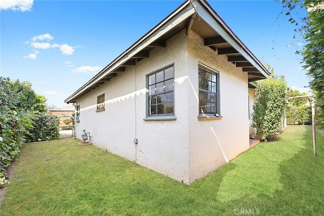 4134 Rio Hondo Ave, Rosemead, CA 91770 - view of side of home with stucco siding and a lawn