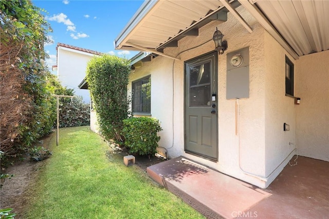 4134 Rio Hondo Ave, Rosemead, CA 91770 - doorway to property with stucco siding and a lawn