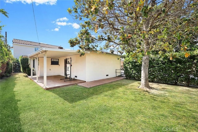 4134 Rio Hondo Ave, Rosemead, CA 91770 - rear view of house featuring stucco siding, a patio, and a lawn