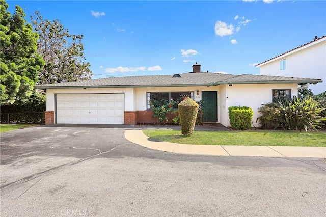 4134 Rio Hondo Ave, Rosemead, CA 91770 - ranch-style house with driveway, a garage, brick siding, and a chimney