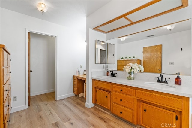 7009 Etter St, Bakersfield, CA 93308 - full bathroom with double vanity and wood finished floors