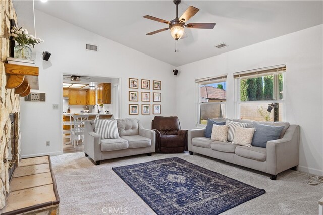 7009 Etter St, Bakersfield, CA 93308 - living room featuring light colored carpet, a ceiling fan, and vaulted ceiling