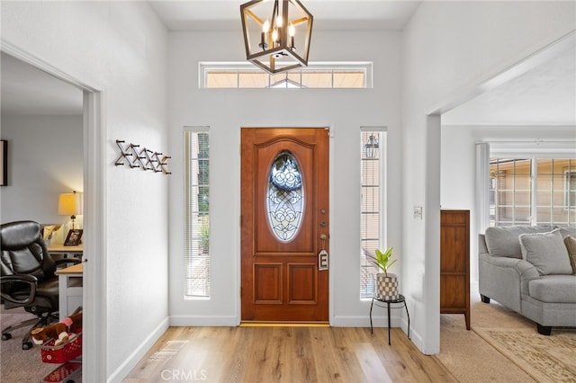 7009 Etter St, Bakersfield, CA 93308 - entrance foyer featuring wood finished floors, plenty of natural light, a chandelier, and a high ceiling