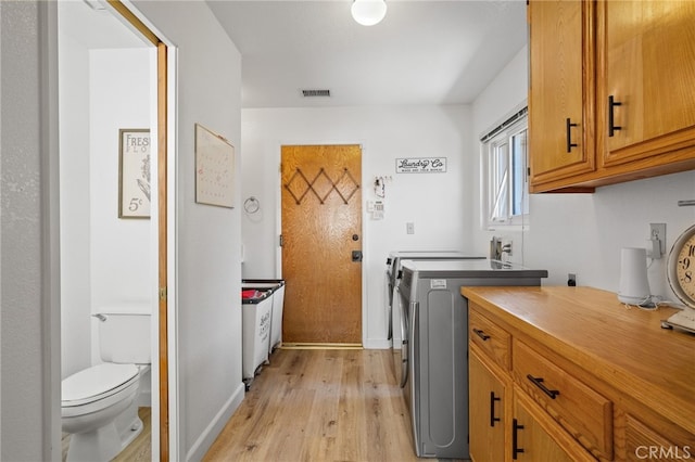7009 Etter St, Bakersfield, CA 93308 - laundry area featuring independent washer and dryer and light wood-style floors
