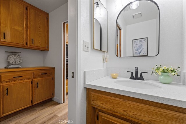 7009 Etter St, Bakersfield, CA 93308 - bathroom with vanity and wood finished floors