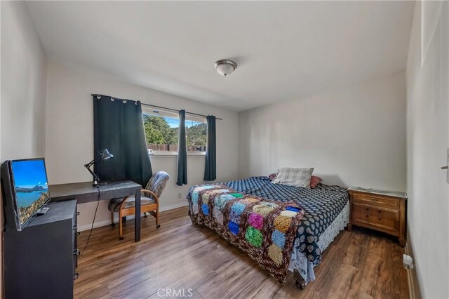 13169 Third St, Clearlake Oaks, CA 95423 - bedroom with wood finished floors