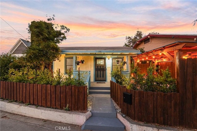 1146 N Loma Vista Dr, Long Beach, CA 90813 - bungalow featuring covered porch and a fenced front yard