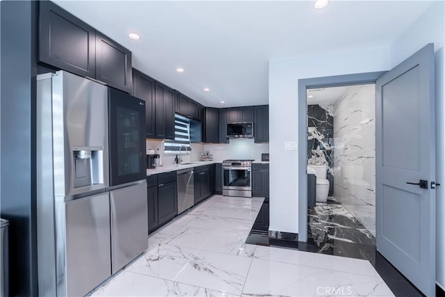 4405 Ventura Canyon Ave, Sherman Oaks, CA 91423 - kitchen with stainless steel appliances, light marble finish floors, recessed lighting, and light countertops