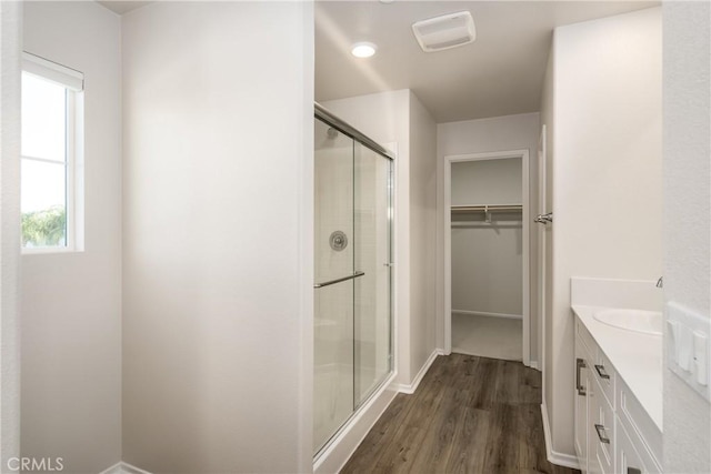 31844 Gimbal Way, Winchester, CA 92596 - full bath featuring a stall shower, vanity, a walk in closet, and wood finished floors