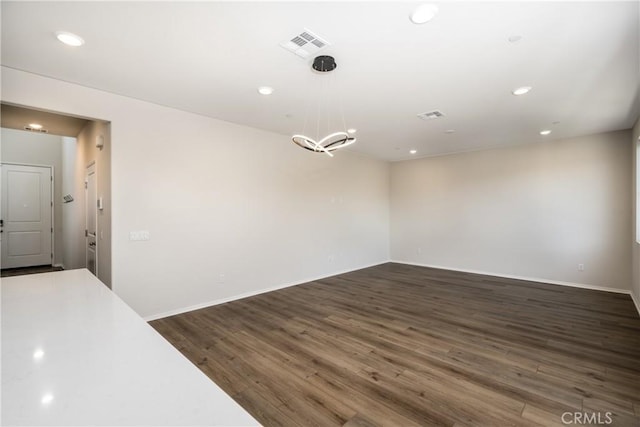 31844 Gimbal Way, Winchester, CA 92596 - spare room featuring dark wood-style flooring, recessed lighting, and a chandelier