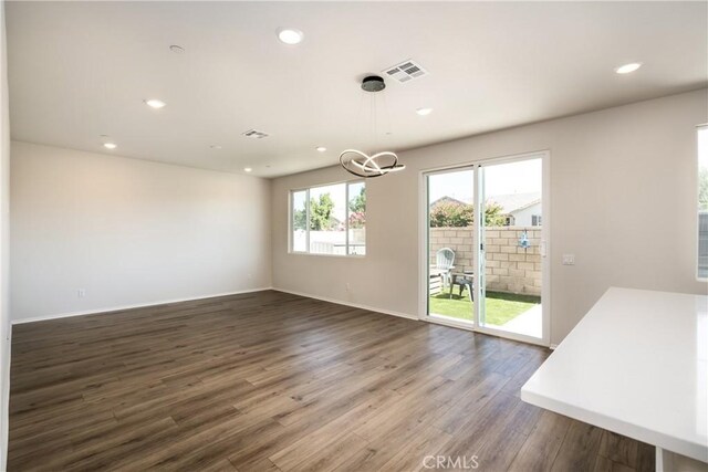 31844 Gimbal Way, Winchester, CA 92596 - unfurnished dining area with wood finished floors, a chandelier, and recessed lighting