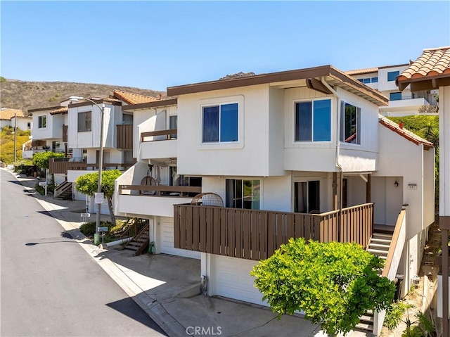 881 Calle Pluma, San Clemente, CA 92673 - view of building exterior featuring a garage, stairway, and a residential view