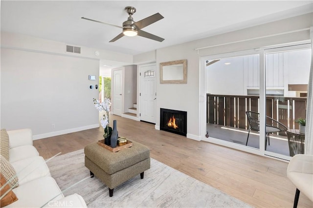 881 Calle Pluma, San Clemente, CA 92673 - living area with a ceiling fan, hardwood / wood-style floors, and a lit fireplace
