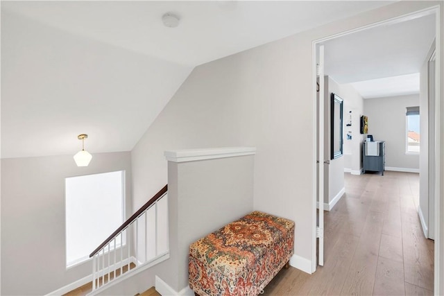 881 Calle Pluma, San Clemente, CA 92673 - hallway with light wood finished floors, lofted ceiling, and an upstairs landing