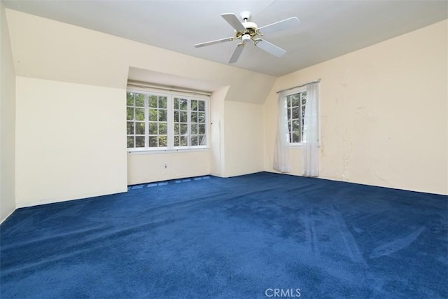 4312 Noble Ave, Sherman Oaks, CA 91403 - empty room with healthy amount of natural light, carpet floors, ceiling fan, and vaulted ceiling
