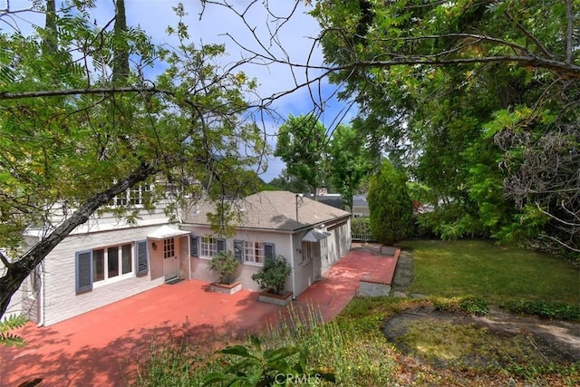 4312 Noble Ave, Sherman Oaks, CA 91403 - back of house featuring a yard and a patio
