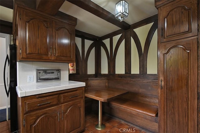 4312 Noble Ave, Sherman Oaks, CA 91403 - kitchen with tasteful backsplash, tile countertops, and fridge