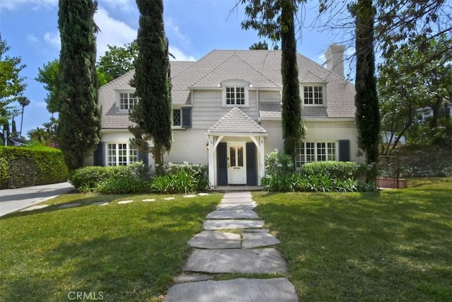 4312 Noble Ave, Sherman Oaks, CA 91403 - view of front of house with a front yard, a chimney, and roof with shingles
