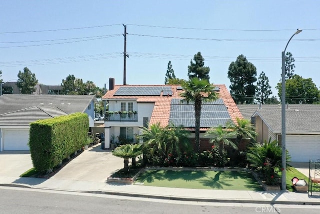 17230 San Lorenzo Cir, Fountain Valley, CA 92708 - view of front of house featuring roof mounted solar panels, a tile roof, stucco siding, and a balcony