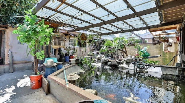 17230 San Lorenzo Cir, Fountain Valley, CA 92708 - view of patio / terrace featuring a small pond
