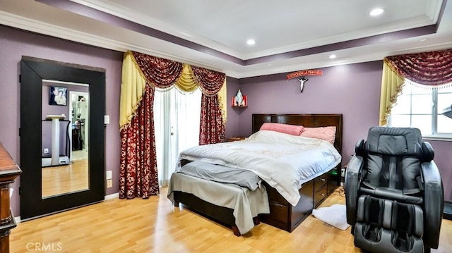 17230 San Lorenzo Cir, Fountain Valley, CA 92708 - bedroom featuring light wood-style flooring, a tray ceiling, crown molding, and recessed lighting