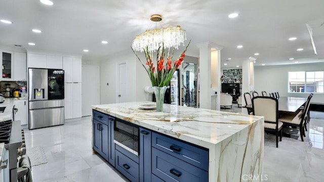 17230 San Lorenzo Cir, Fountain Valley, CA 92708 - kitchen with appliances with stainless steel finishes, recessed lighting, white cabinetry, light stone countertops, and glass insert cabinets
