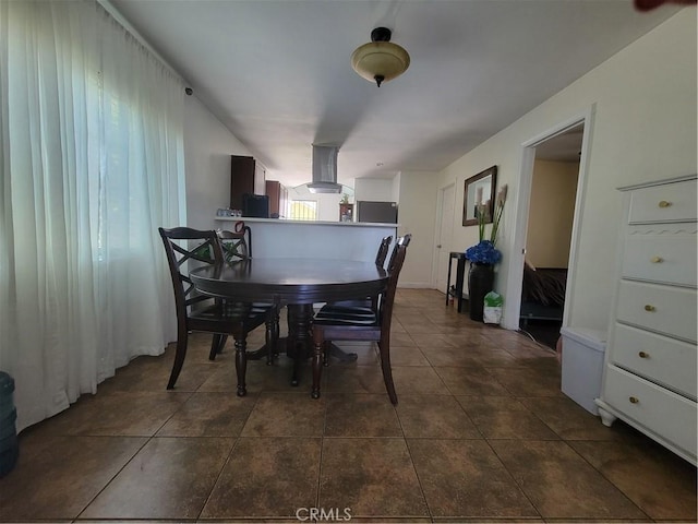 4434 Crocker St, Los Angeles, CA 90011 - dining room with dark tile patterned flooring
