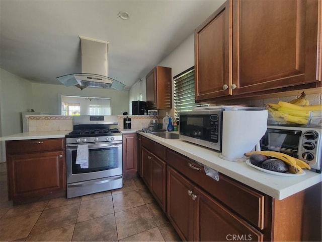 4434 Crocker St, Los Angeles, CA 90011 - kitchen with appliances with stainless steel finishes, extractor fan, a peninsula, light countertops, and tile patterned floors