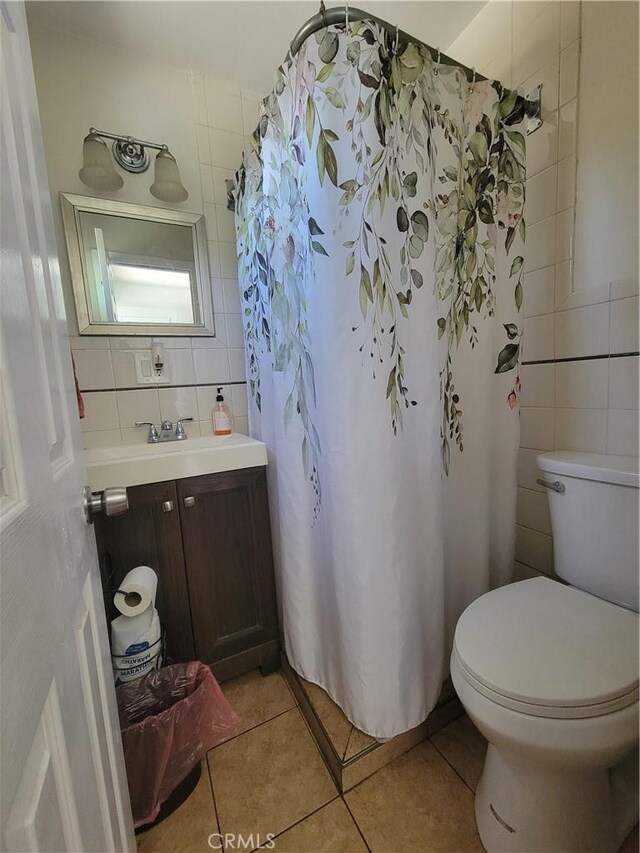 4434 Crocker St, Los Angeles, CA 90011 - full bath with tile walls, tile patterned floors, vanity, a shower with curtain, and tasteful backsplash