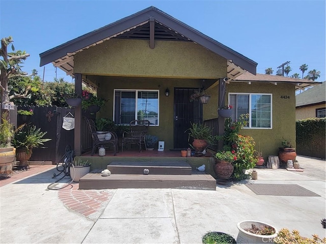 4434 Crocker St, Los Angeles, CA 90011 - bungalow-style house with stucco siding and a patio area