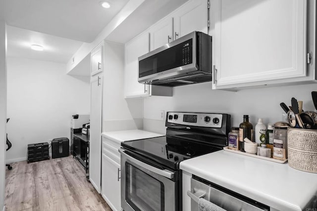 1040 E Washington Ave Unit 31, Escondido, CA 92025 - kitchen featuring stainless steel appliances, white cabinetry, and light wood-style floors