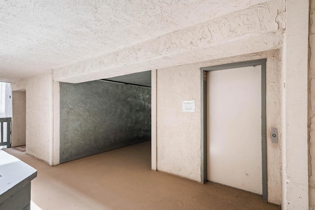 1040 E Washington Ave Unit 31, Escondido, CA 92025 - below grade area featuring elevator and a textured ceiling
