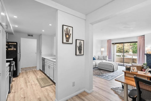 1040 E Washington Ave Unit 31, Escondido, CA 92025 - kitchen with appliances with stainless steel finishes, light wood-style floors, light countertops, and recessed lighting
