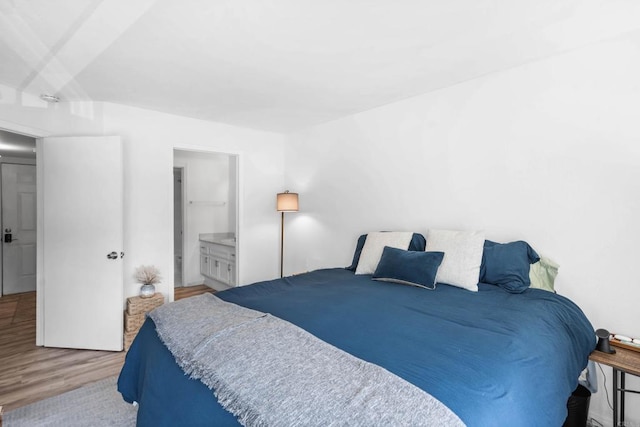 1040 E Washington Ave Unit 31, Escondido, CA 92025 - bedroom with wood finished floors and connected bathroom