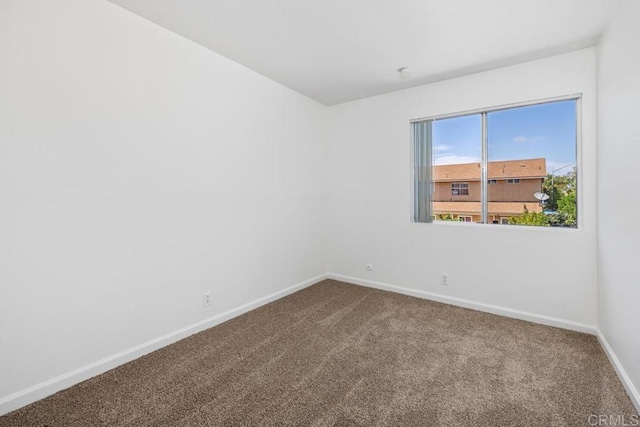 3670 Forest Glen Rd, San Diego, CA 92154 - empty room with baseboards and dark colored carpet