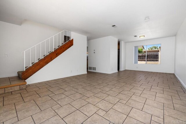 3670 Forest Glen Rd, San Diego, CA 92154 - unfurnished living room with stairs and baseboards