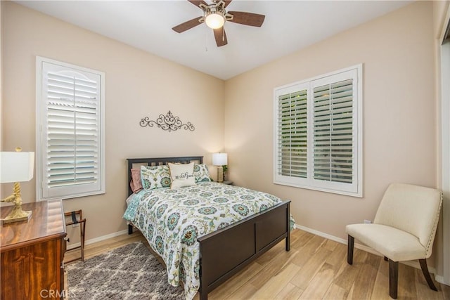 1506 Pierce Ml, Beaumont, CA 92223 - bedroom featuring wood finished floors, multiple windows, and a ceiling fan