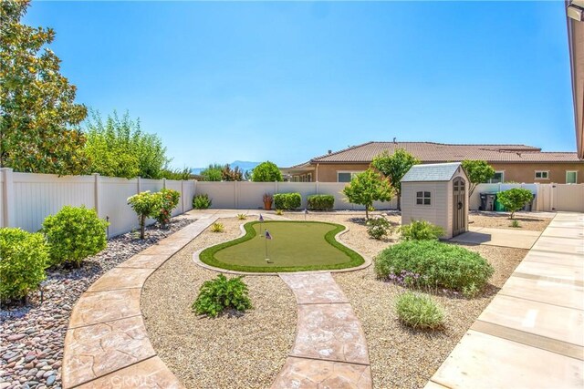 1506 Pierce Ml, Beaumont, CA 92223 - fenced backyard with a putting green and a shed
