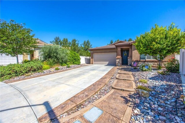 1506 Pierce Ml, Beaumont, CA 92223 - view of front facade featuring an attached garage, stucco siding, concrete driveway, and stone siding